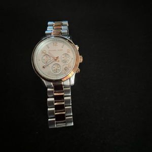 Michael Kors rose gold and stainless steel watch. Model MK 5313 CE.